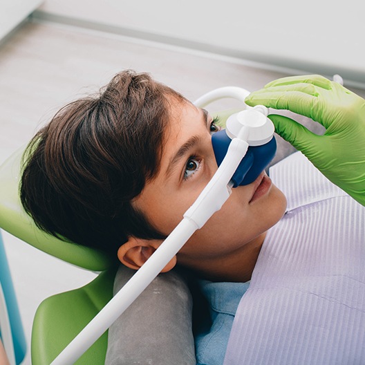 Young boy with nitrous oxide sedation dentistry mask