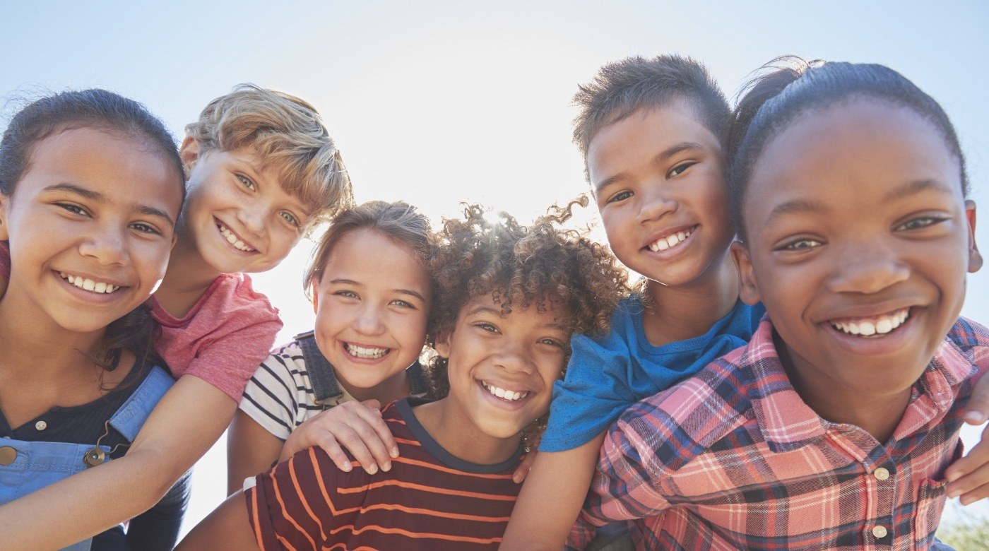 Group of kids laughing outdoors