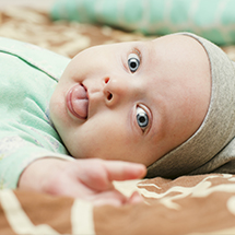 Baby sticking out tongue before tongue tie treatment