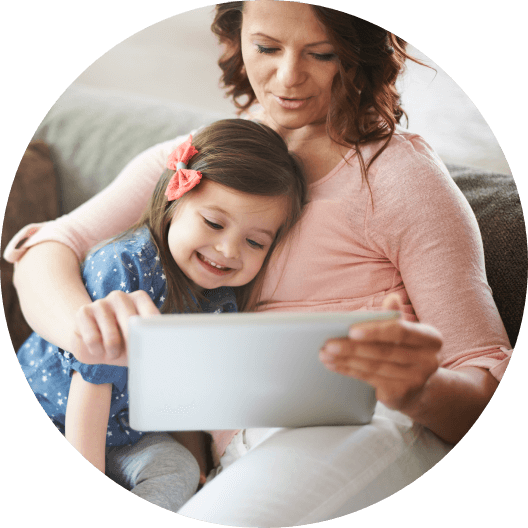 Mother filling out daughter's dental forms on tablet computer