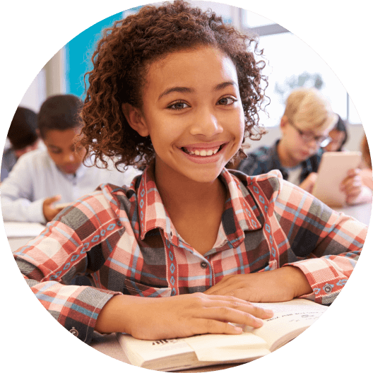 Little girl in classroom smiling