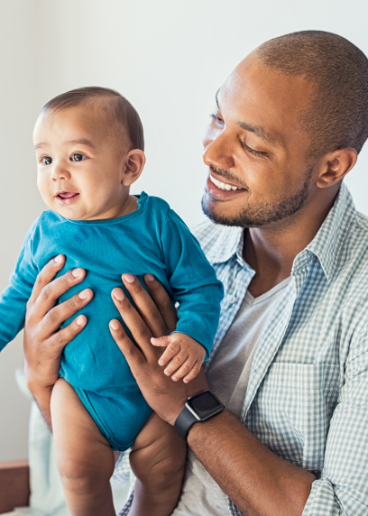 Father holding infant son