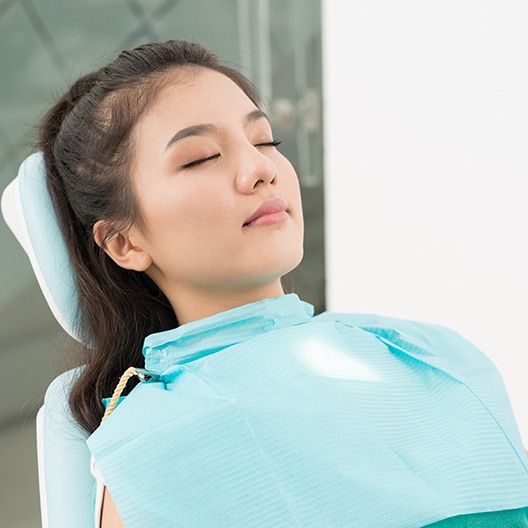 Relaxed dental patient with eyes closed