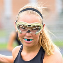 Teen girl with blue athletic mouthguard