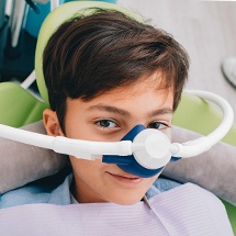 Young boy with nitrous oxide sedation dentistry mask