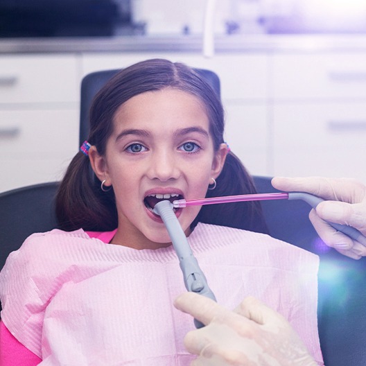 Dentist capturing images of child's smile