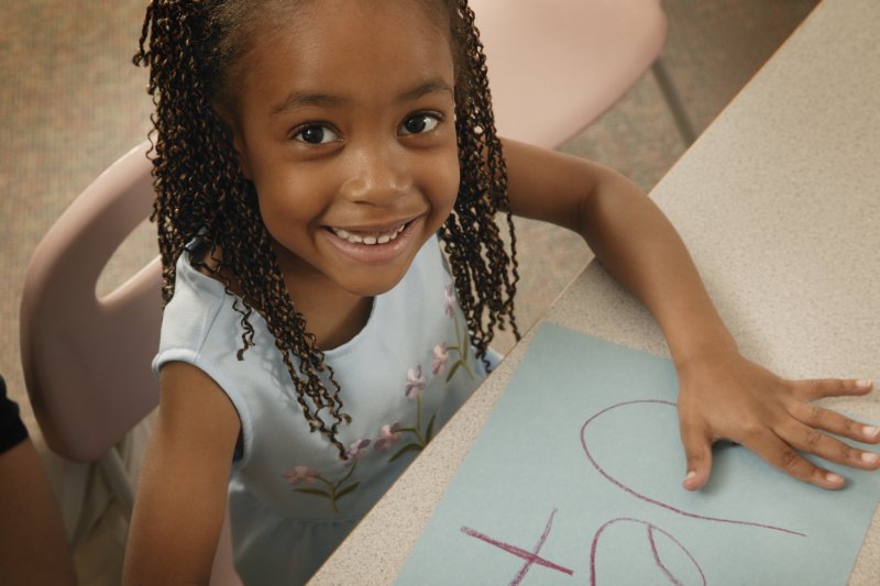 little girl happy about her time at school