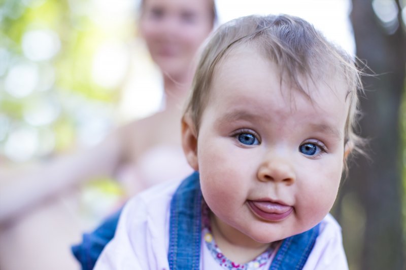 a baby with its tongue out