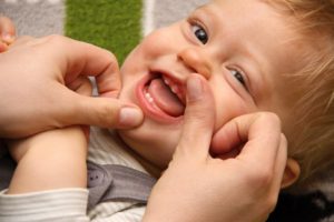 closer look at a teething baby