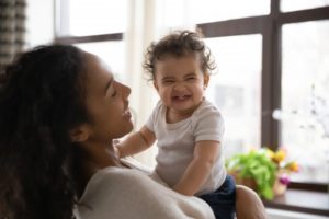 happy mom and baby knowing facts about children’s dental health