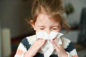 little girl who needs to protect her smile during cold and flu season