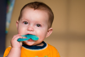 a child using a teething ring