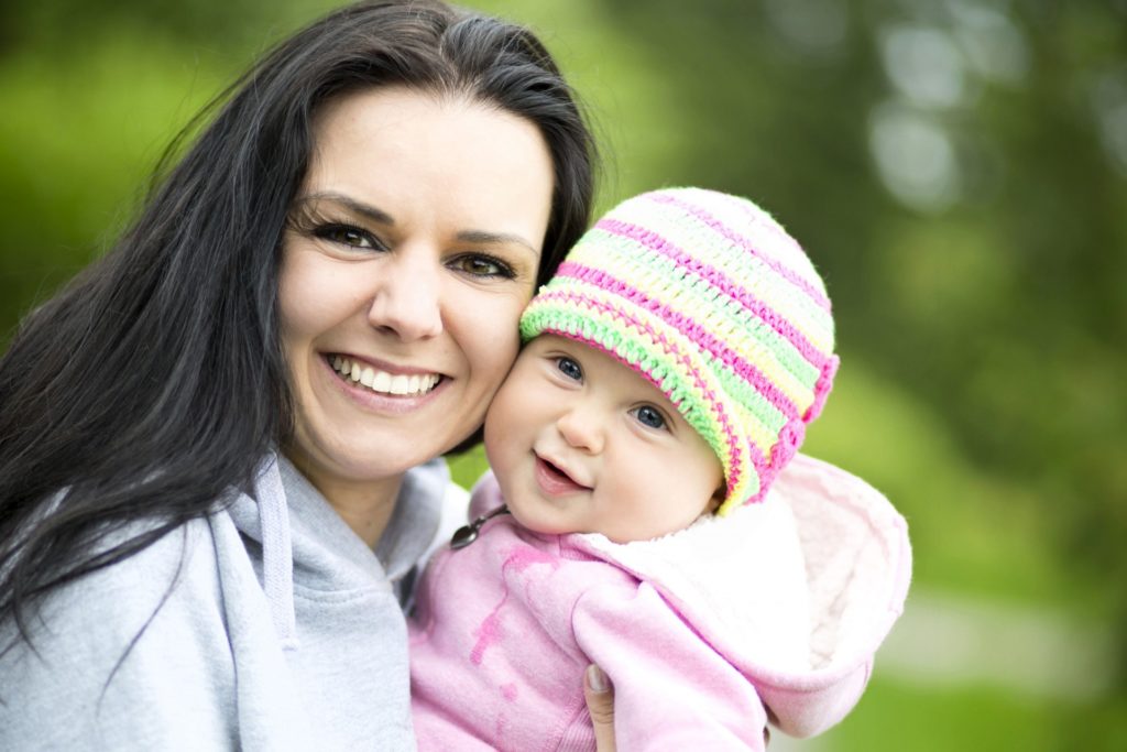 parent holding baby