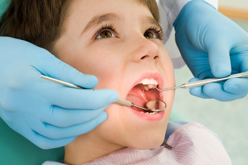 young child receiving a dental checkup